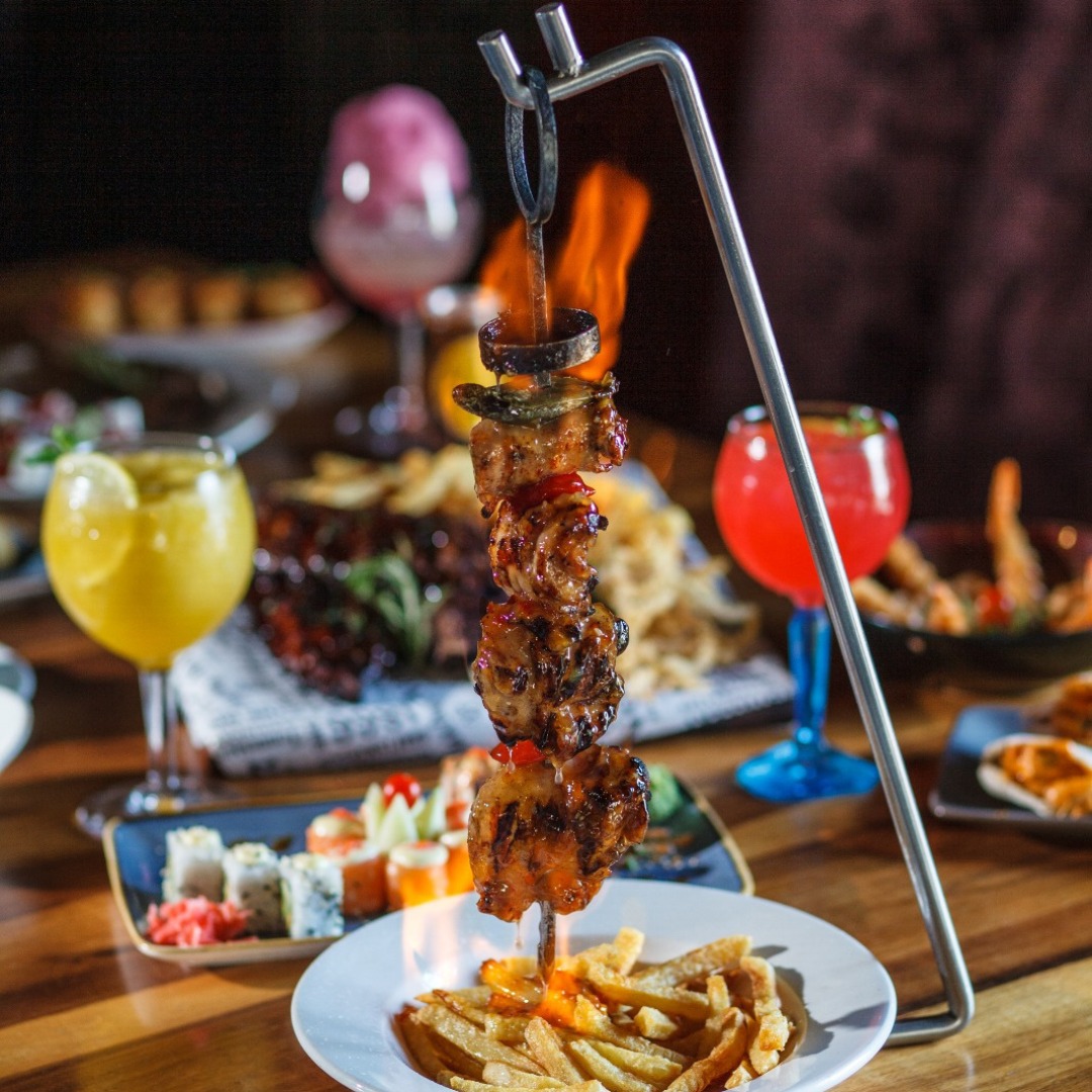 Flaming hanging espetada with sushi and cocktails at Jozi Gin