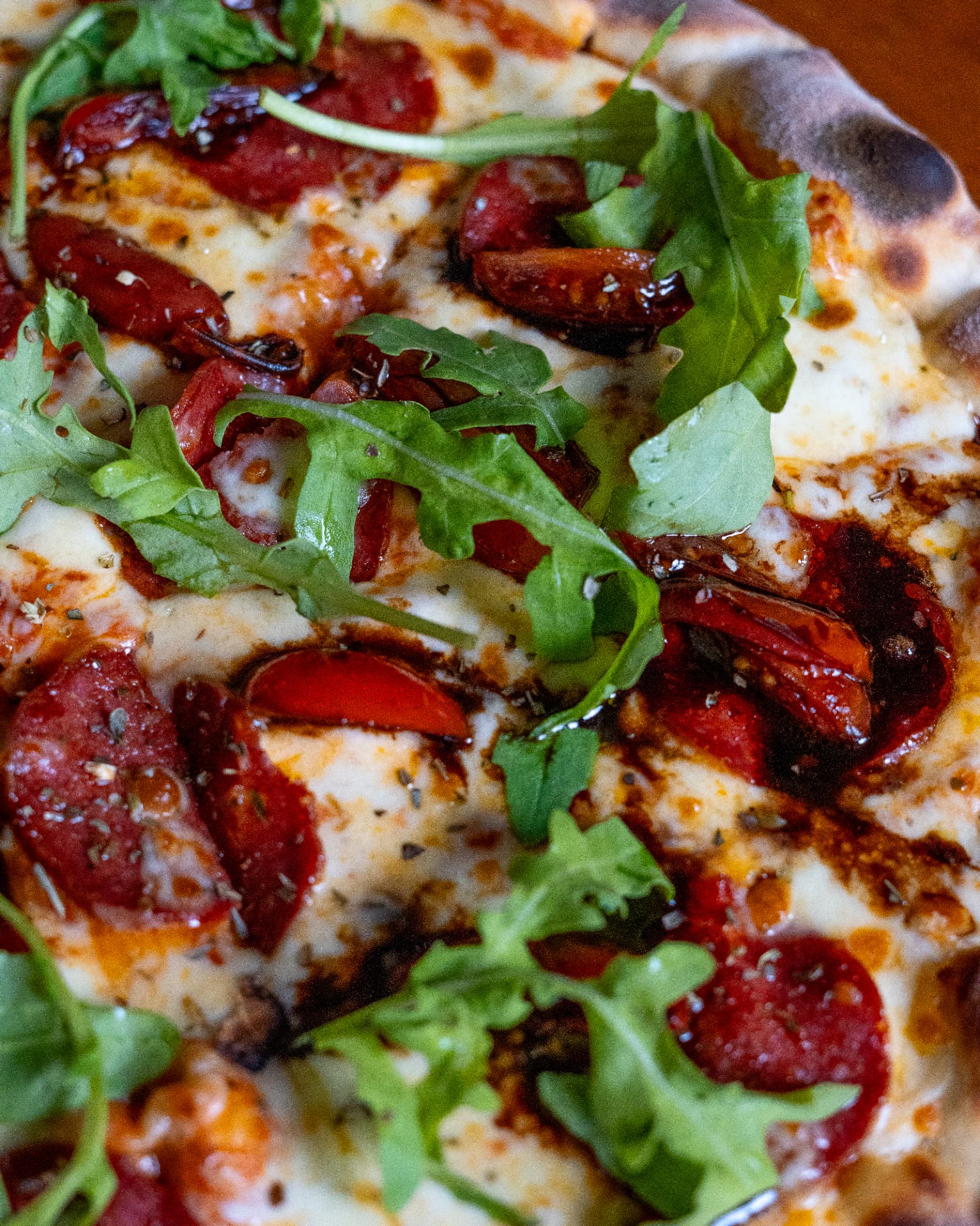 Neapolitan-style pizza with roasted tomatoes and rocket at Jozi Gin